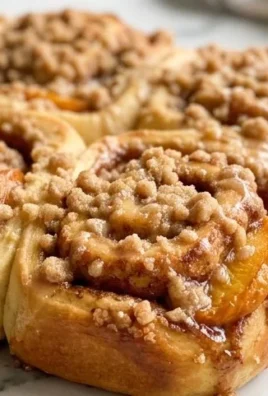 Peach Cobbler Cinnamon Rolls with Crum extractb Topping